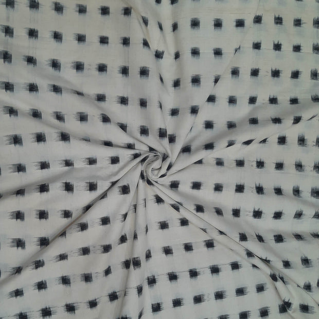 Handwoven double ikat pure cotton fabric in off white with black squares