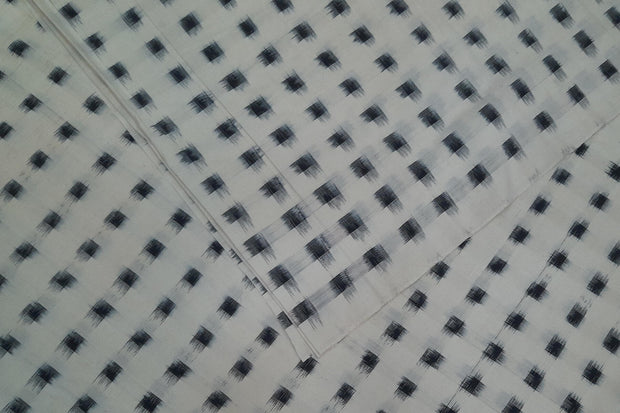 Handwoven double ikat pure cotton fabric in off white with black squares