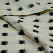 Handwoven double ikat pure cotton fabric in off white with black squares