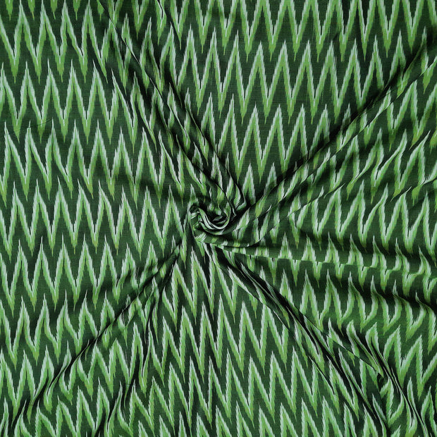 Handwoven ikat  pure cotton fabric in green in zig zag pattern