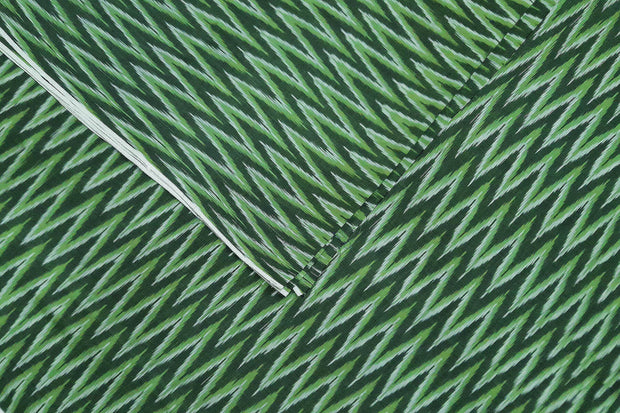 Handwoven ikat  pure cotton fabric in green in zig zag pattern