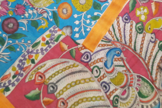 Hand painted Kalamkari on Bangalore silk saree in turquoise blue with  fish , birds  and lotus motifs.