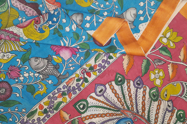 Hand painted Kalamkari on Bangalore silk saree in turquoise blue with  fish , birds  and lotus motifs.