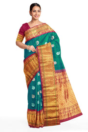 Handwoven Kanchi pure silk saree in dual tone blue with silver motifs.