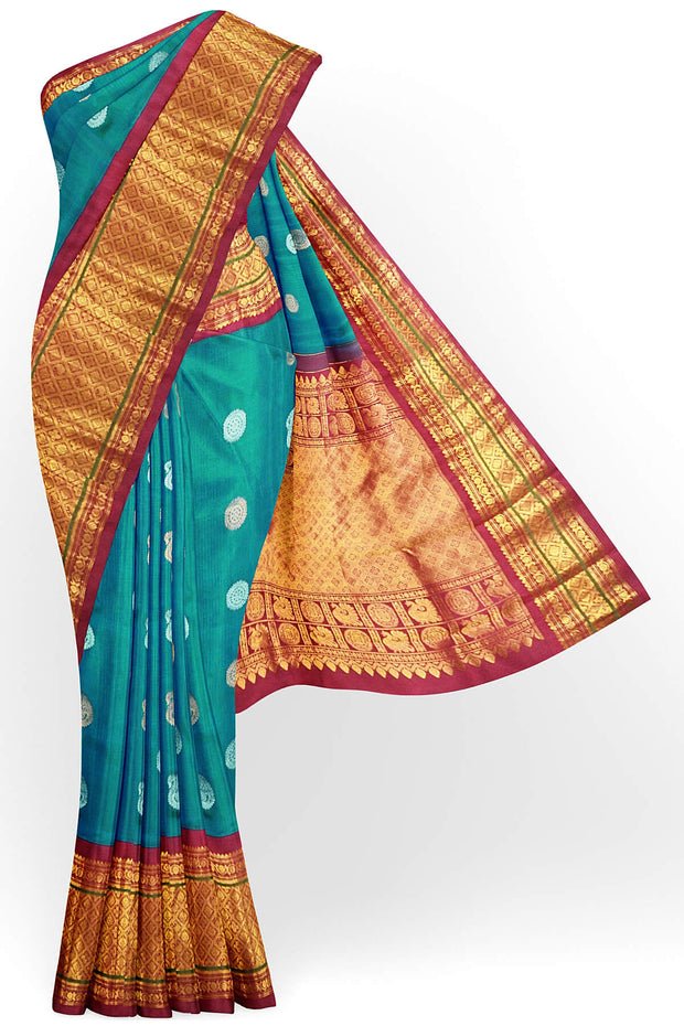 Handwoven Kanchi pure silk saree in dual tone blue with silver motifs.