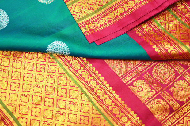 Handwoven Kanchi pure silk saree in dual tone blue with silver motifs.