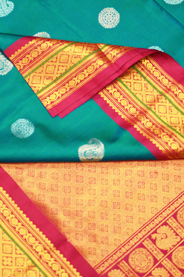 Handwoven Kanchi pure silk saree in dual tone blue with silver motifs.