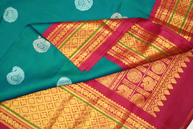Handwoven Kanchi pure silk saree in dual tone blue with silver motifs.