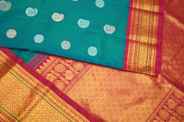 Handwoven Kanchi pure silk saree in dual tone blue with silver motifs.