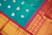 Handwoven Kanchi pure silk saree in dual tone blue with silver motifs.