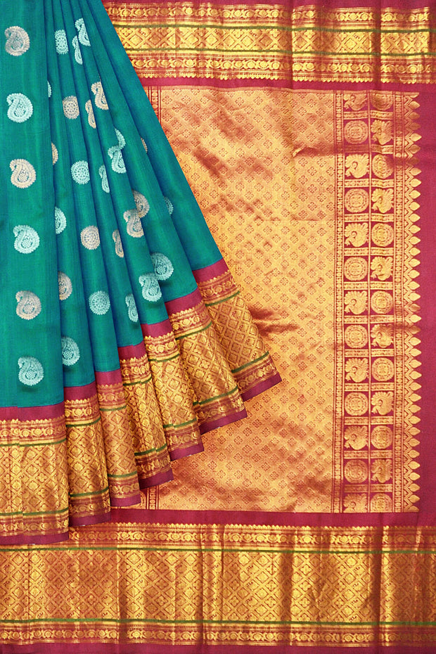 Handwoven Kanchi pure silk saree in dual tone blue with silver motifs.