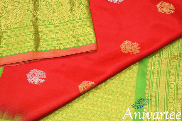 Handwoven Kanchi pure silk pure zari saree in red with peacock motifs in gold and silver