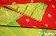 Handwoven Kanchi pure silk pure zari saree in red with peacock motifs in gold and silver