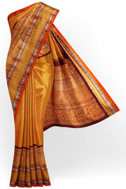 Handwoven Kanchi pure silk  brocade saree in mustard , accentuated with peacock motifs in the border
