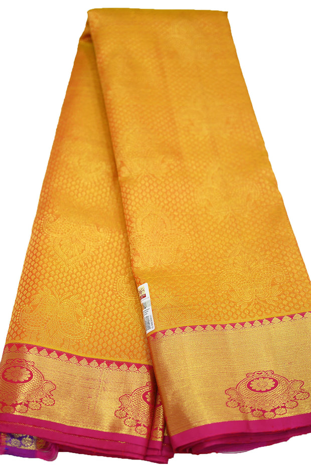 Kanchi silk brocade saree in yellow with contrast pallu in pink