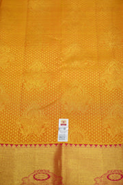 Kanchi silk brocade saree in yellow with contrast pallu in pink