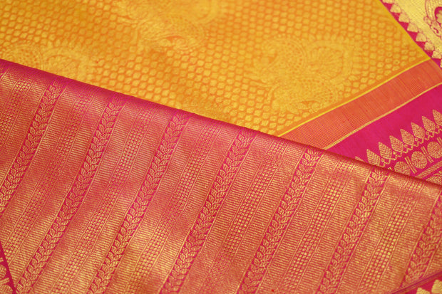 Kanchi silk brocade saree in yellow with contrast pallu in pink