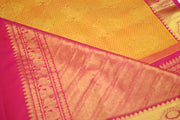 Kanchi silk brocade saree in yellow with contrast pallu in pink