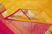 Kanchi silk brocade saree in yellow with contrast pallu in pink
