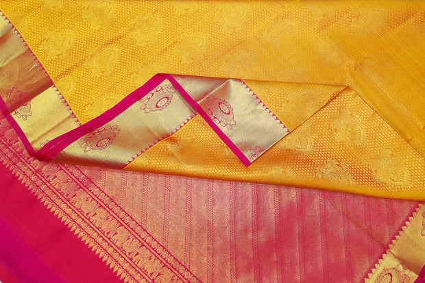 Kanchi silk brocade saree in yellow with contrast pallu in pink