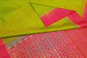 Kanchi pure silk saree in  green with zari lines and  floral pattern in pallu