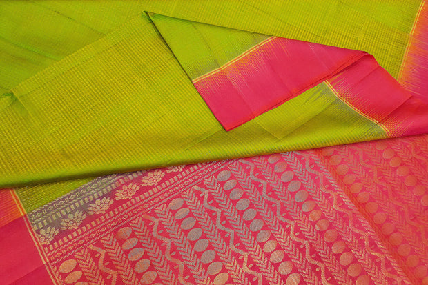 Kanchi pure silk saree in  green with zari lines and  floral pattern in pallu