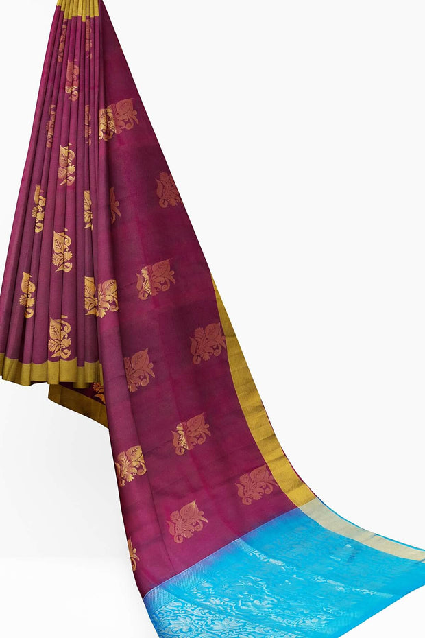 Kanchi pure silk saree in wine with floral motifs on the body.