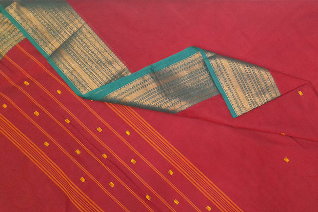 Kanchi pure cotton saree in rust with small buttis