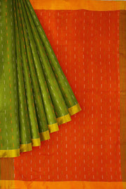 Beautiful pure linen saree in green with a pattern on the body & a contrast pallu in orange