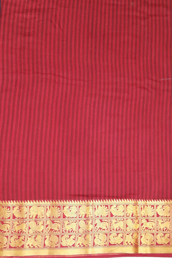An  electric blue shade moonga silk saree with  copper red weaved zari border.