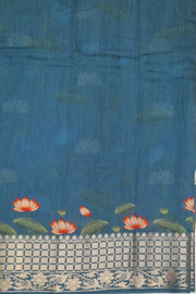 The pichwai with cow and lotus motifs .The gorgeous moonga saree has beautiful handwoven zari  borders