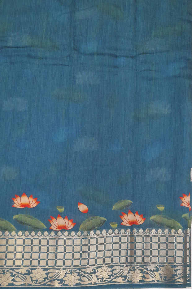 The pichwai with cow and lotus motifs .The gorgeous moonga saree has beautiful handwoven zari  borders