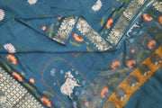 The pichwai with cow and lotus motifs .The gorgeous moonga saree has beautiful handwoven zari  borders