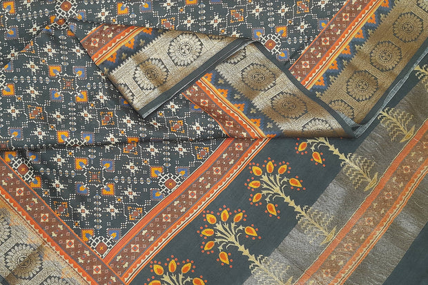 Deep grey Patan Patola printed saree on moonga silk.