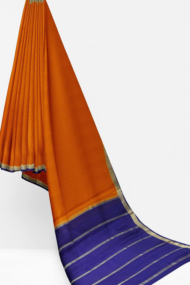 Mysore  crepe  silk saree in rust  with  contrast pallu in blue