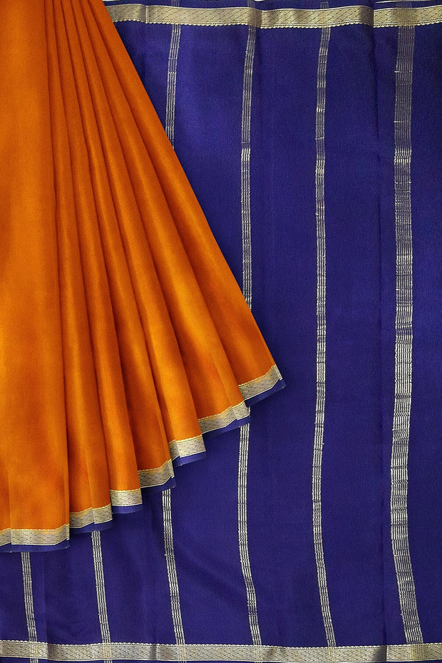 Mysore  crepe  silk saree in rust  with  contrast pallu in blue