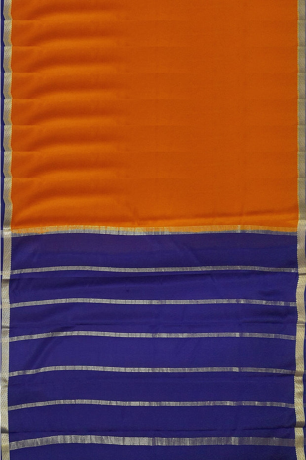 Mysore  crepe  silk saree in rust  with  contrast pallu in blue