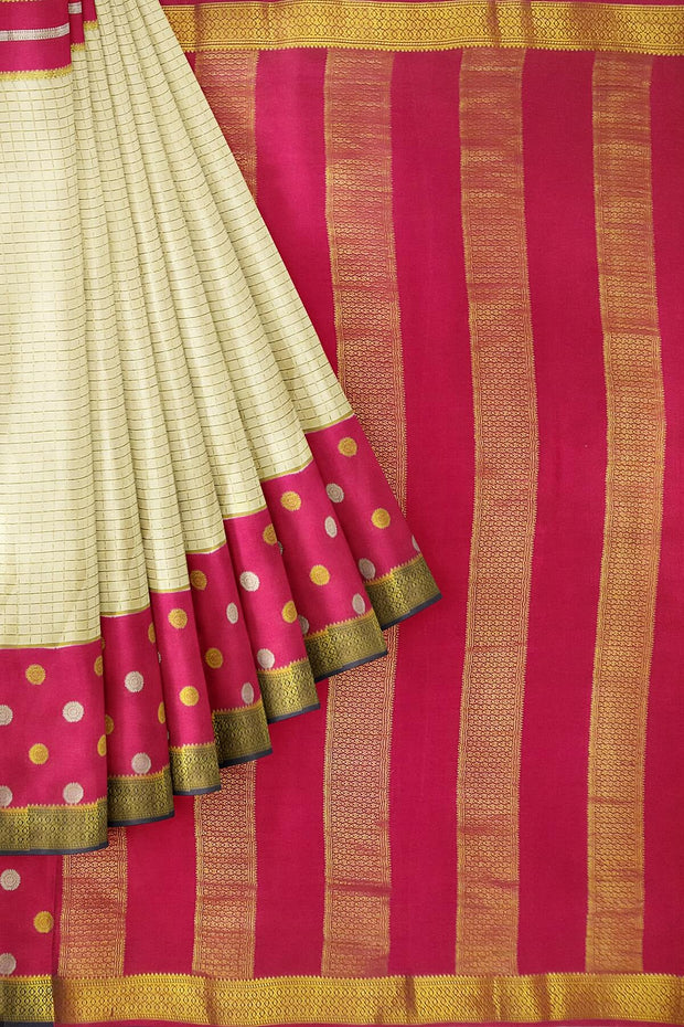 Mysore crepe silk saree in cream with fine zari checks all over the body with a contrast zari woven pallu.
