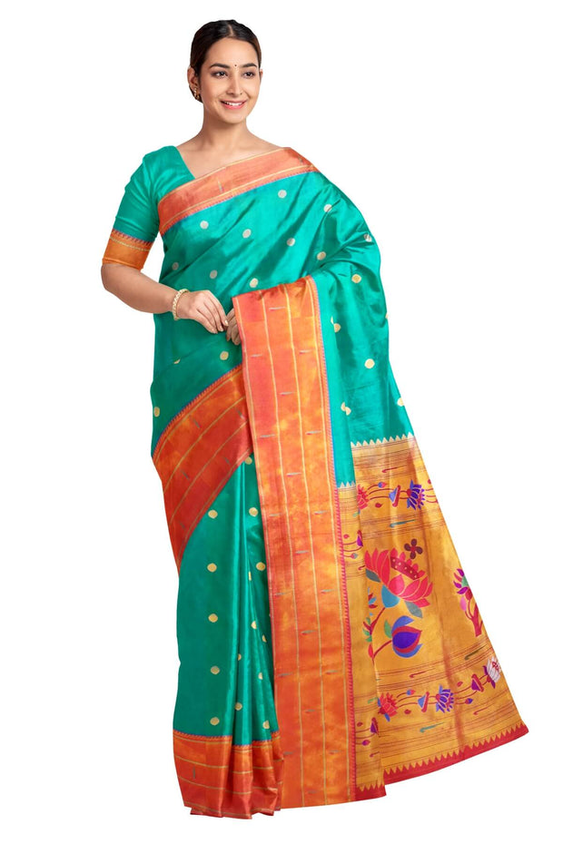 Paithani pure silk saree in teal green with small buttis all over the body and with colourful lotus motifs in gold pallu.