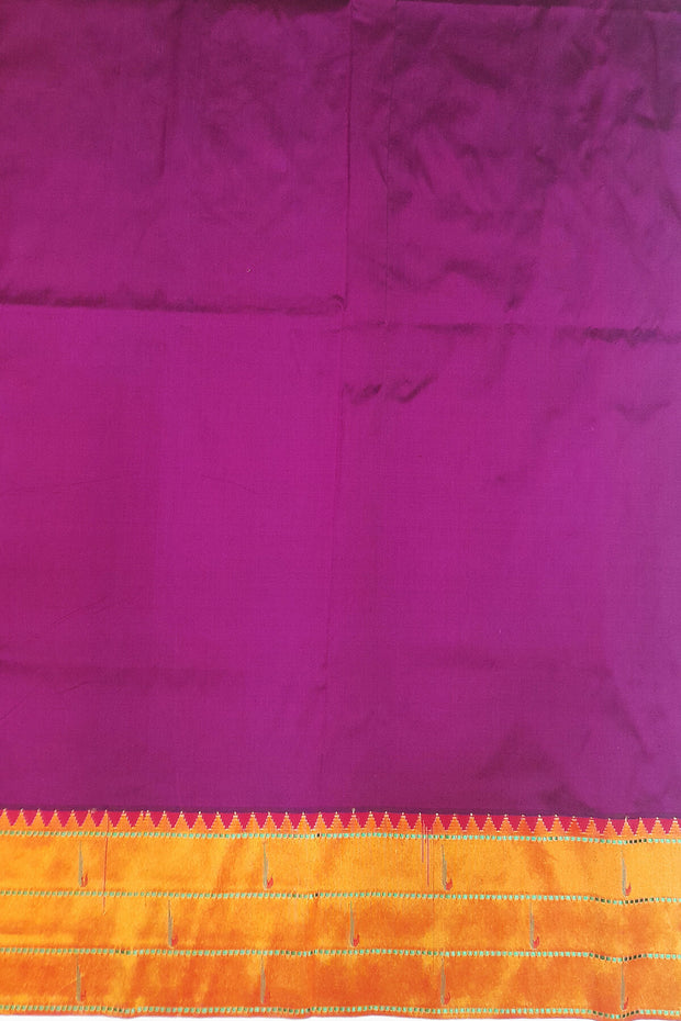 Paithani pure silk saree in purple with small  buttis all over the body.