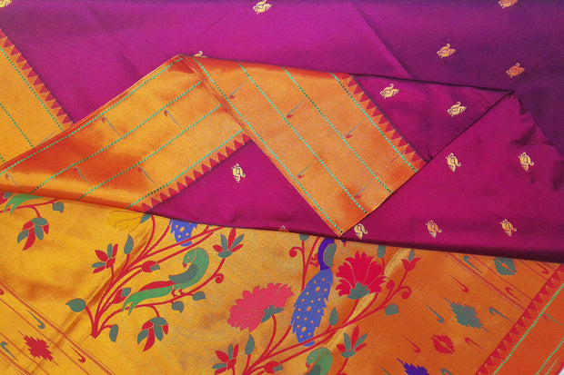 Paithani pure silk saree in purple with small  buttis all over the body.