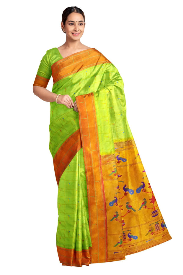 Paithani pure silk saree   in green with muniya motifs in zari checks all over the body.