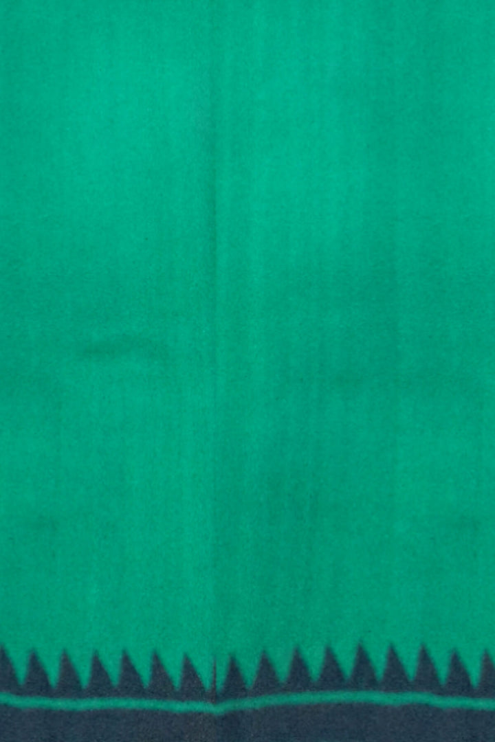 Printed pure silk saree in teal green with paisley motifs all over.