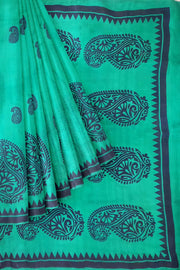 Printed pure silk saree in teal green with paisley motifs all over.