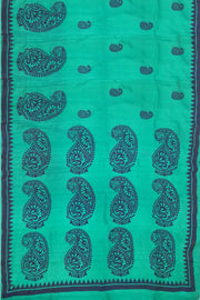 Printed pure silk saree in teal green with paisley motifs all over.