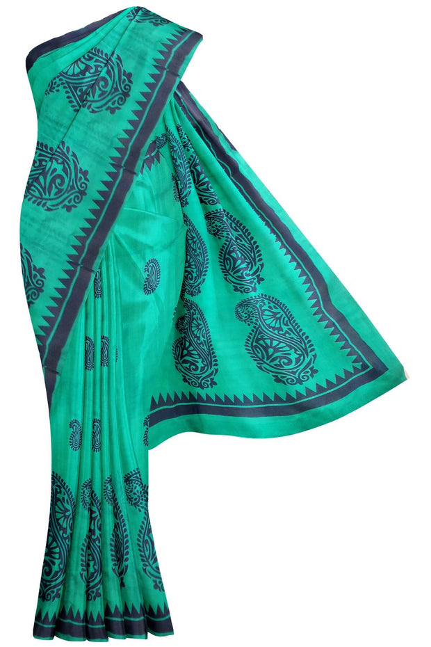 Printed pure silk saree in teal green with paisley motifs all over.