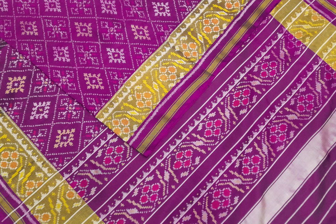 Handwoven Patola pure silk saree in purple  in diamond  pattern