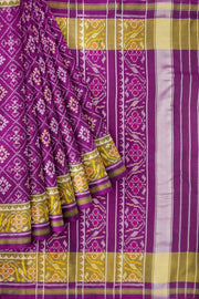 Handwoven Patola pure silk saree in purple  in choktha bhat ( diamond ) pattern