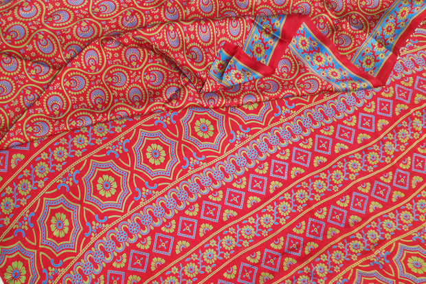 Pure silk saree in red & blue with round & floral motifs   in satin weave