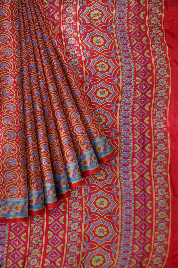 Pure silk saree in red & blue with round & floral motifs   in satin weave